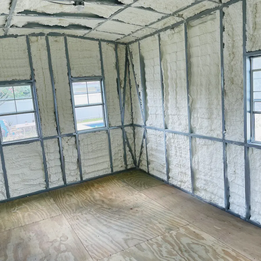 Closed-cell spray foam insulation applied to wall cavities in a residential project in Garden City